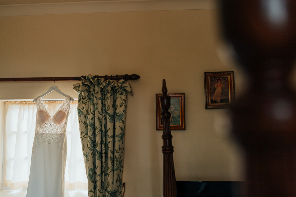 Dress hanging in bridal suite at cockliffe country house