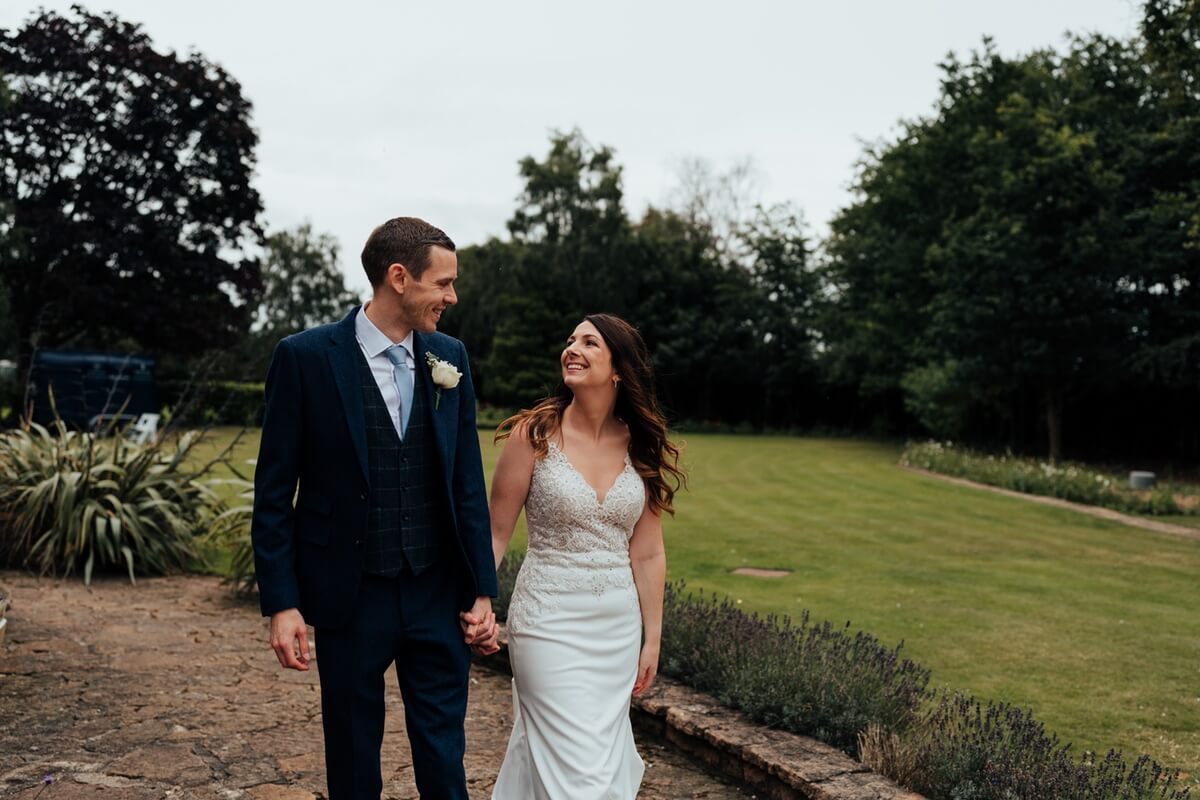 bride and groom walking around grounds of cockliffe country house