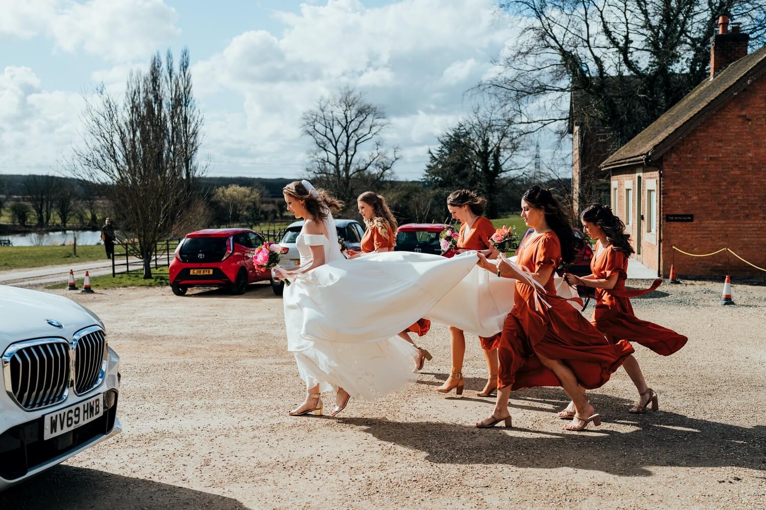 Bride leaving for wedding ceremony at Doddington House