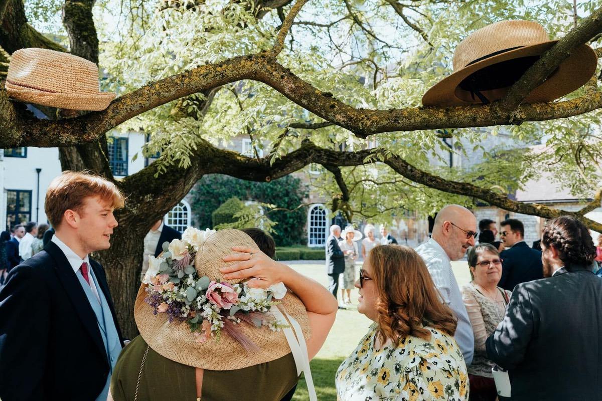 Guests seeking shade on a hot wedding day