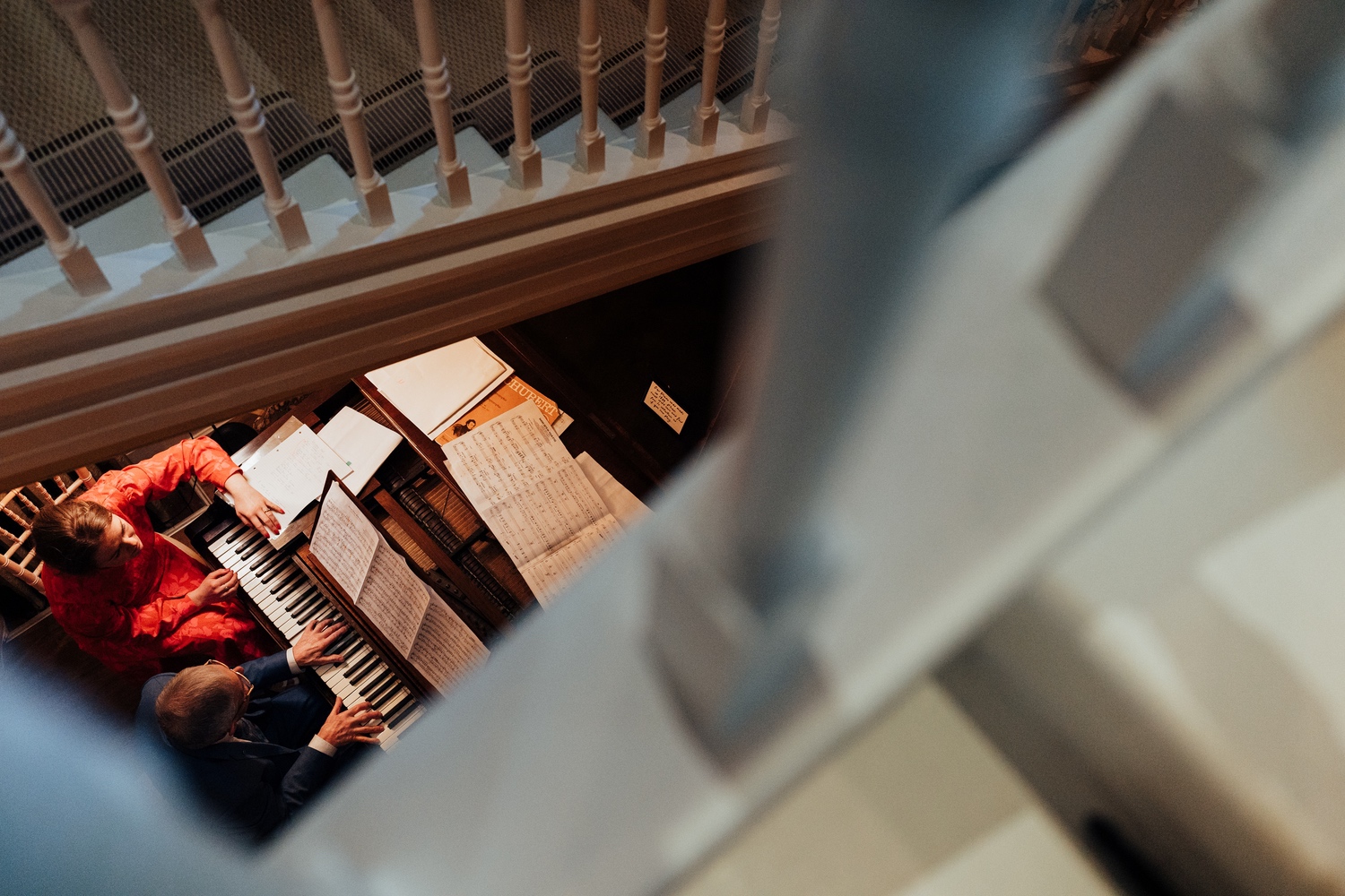 Guests playing piano at Hodsock Priory wedding