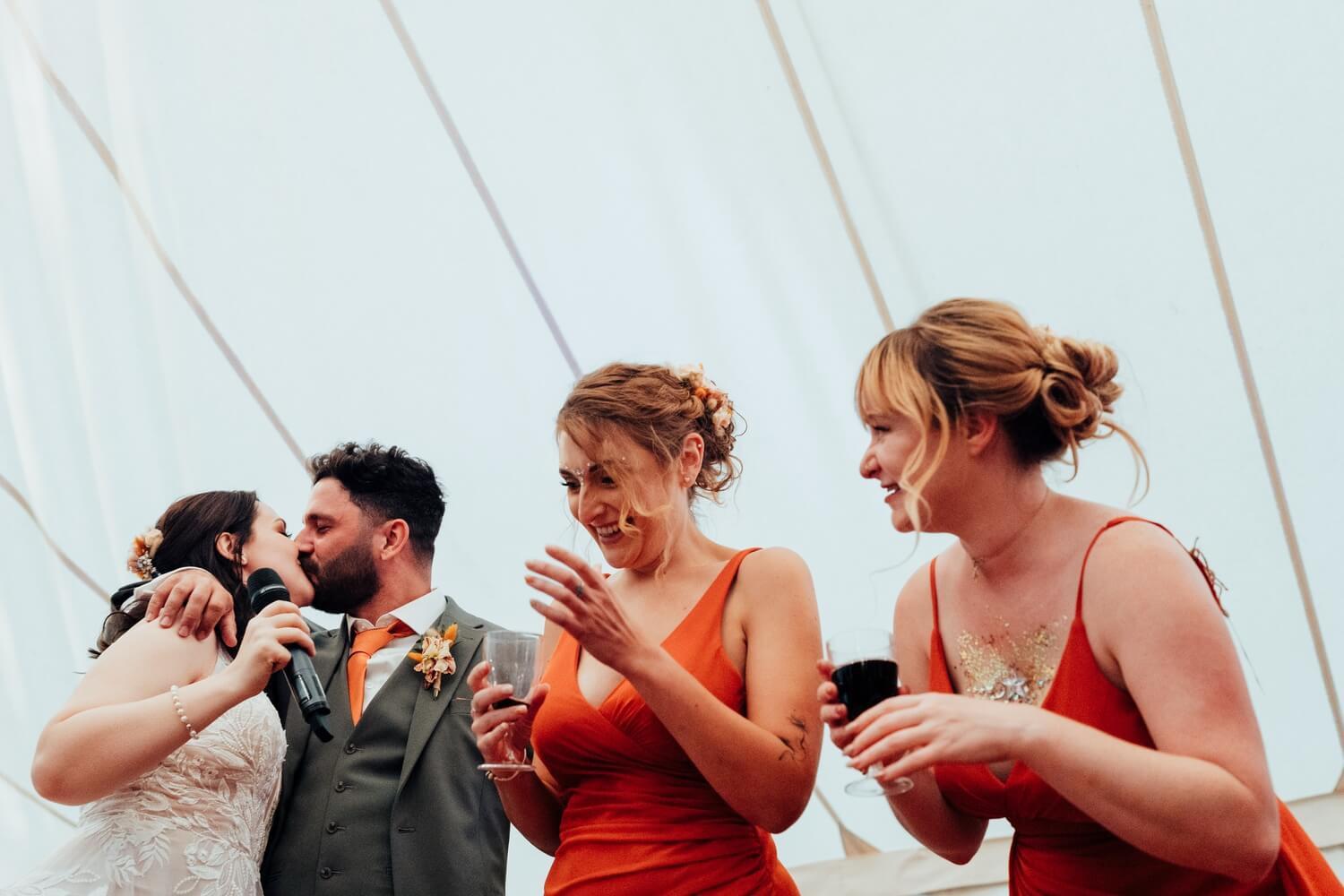 Bride and groom kiss wedding reception at Molecey Mill