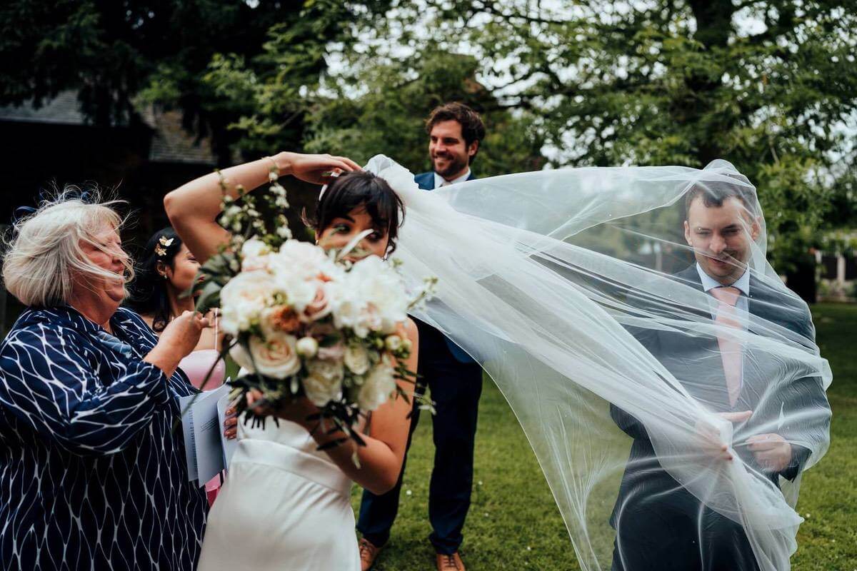 Guest gets trapped in bride's veil shot by Nathan Walker Leicester wedding photographer