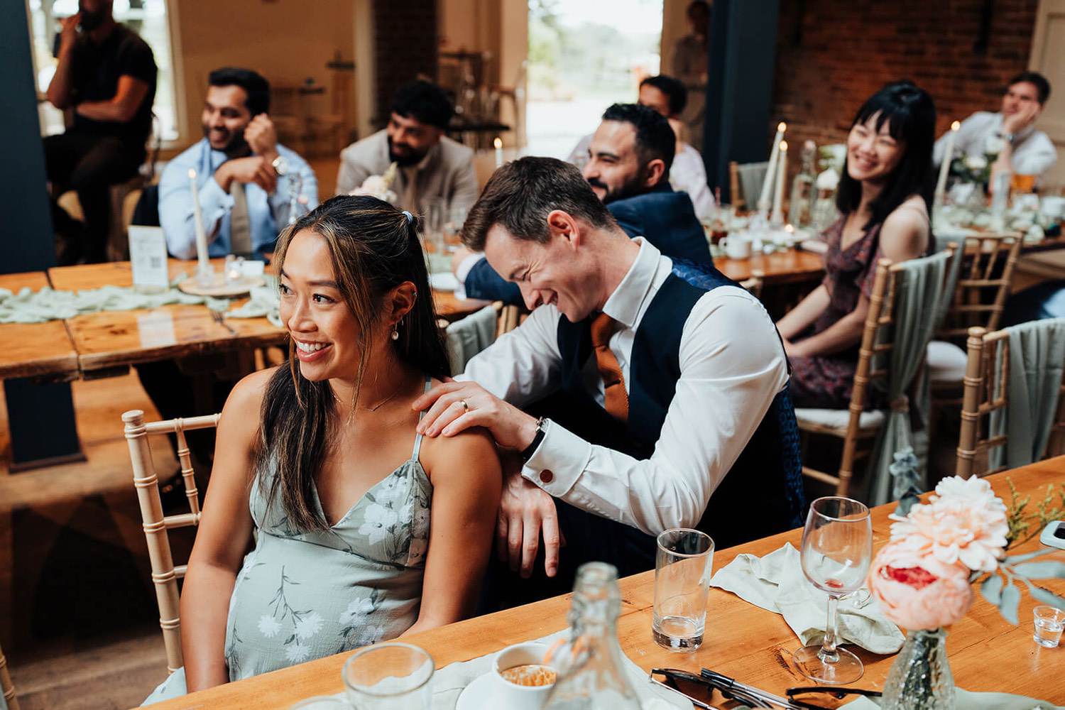 Guests laughing at groom giving a wedding speech at Pheasantry Brewery