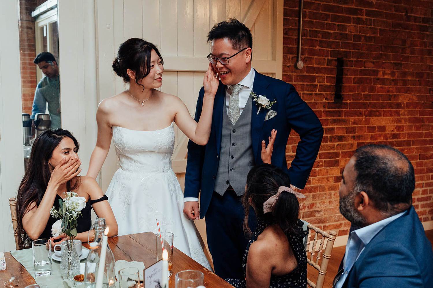 Bride and Groom laughing at wedding