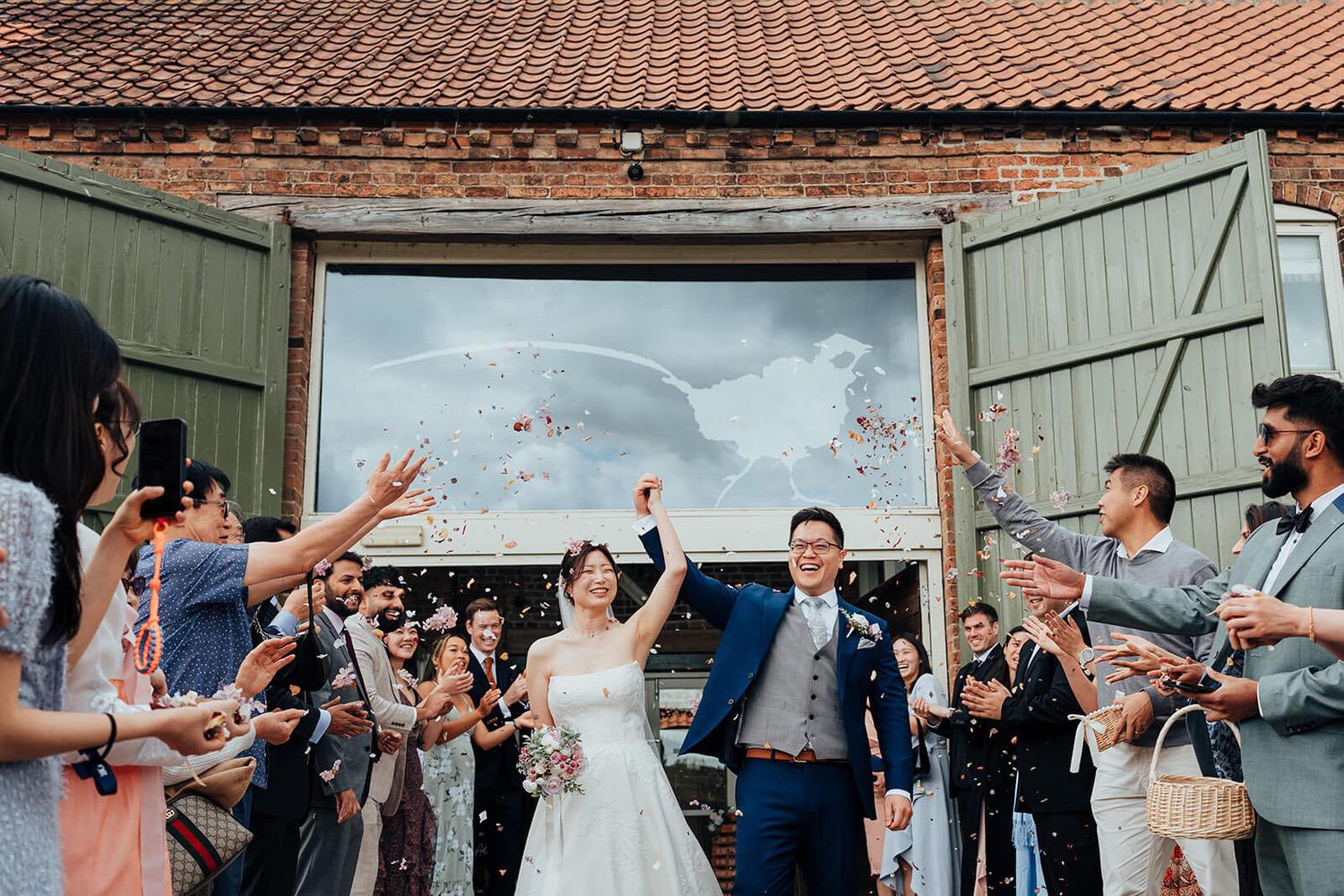 Confetti photo taken outside of Pheasantry Brewery wedding