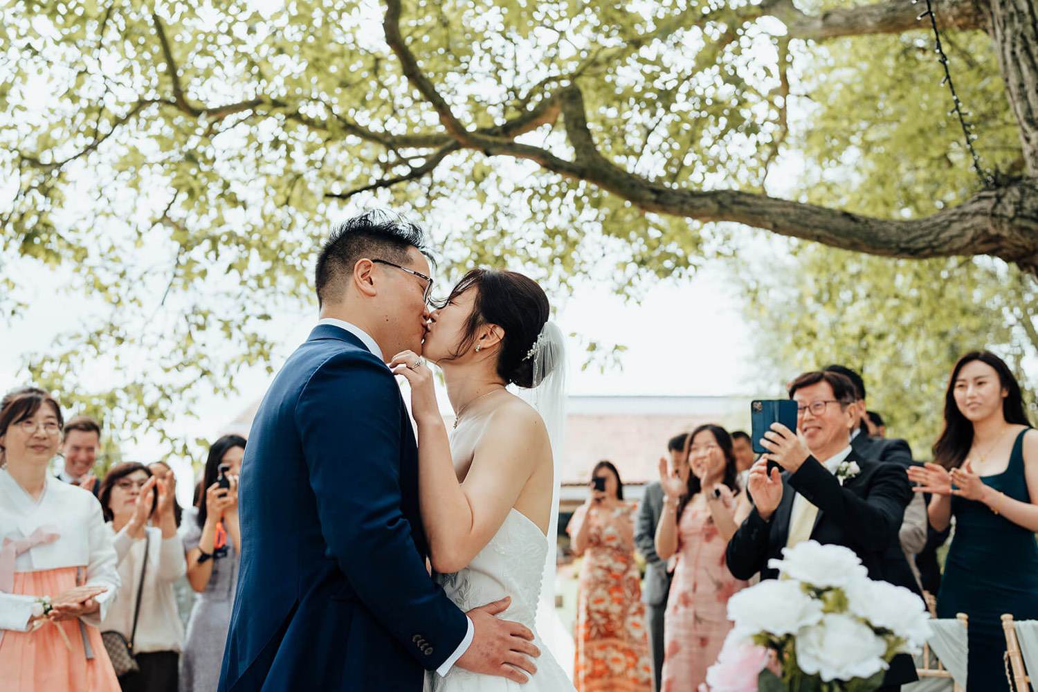 First kiss at Pheasantry Brewery outdoor ceremony