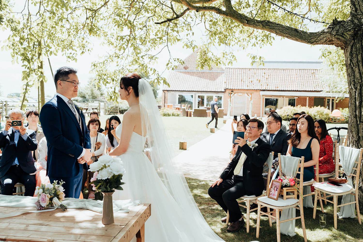 Pheasantry brewery wedding photographer capturing an outdoor ceremony